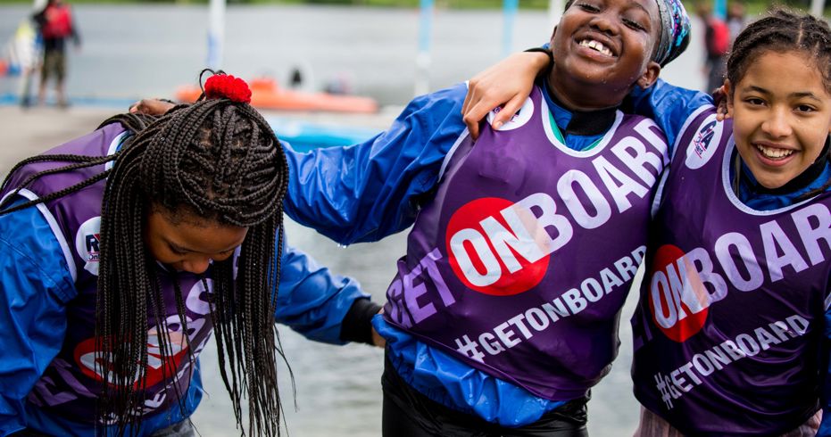 Mid shot of young people on the Onboard programme smiling